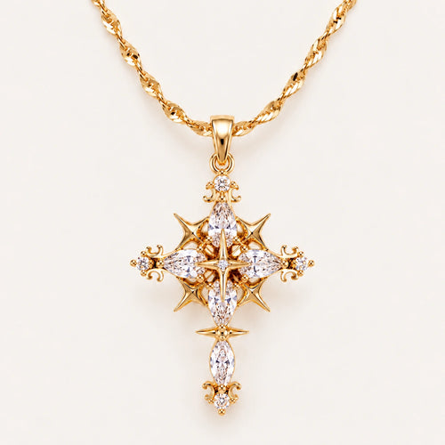 Gold Celestial Gothic Cross Necklace with Clear Zirconia Accents on an Ivory Background