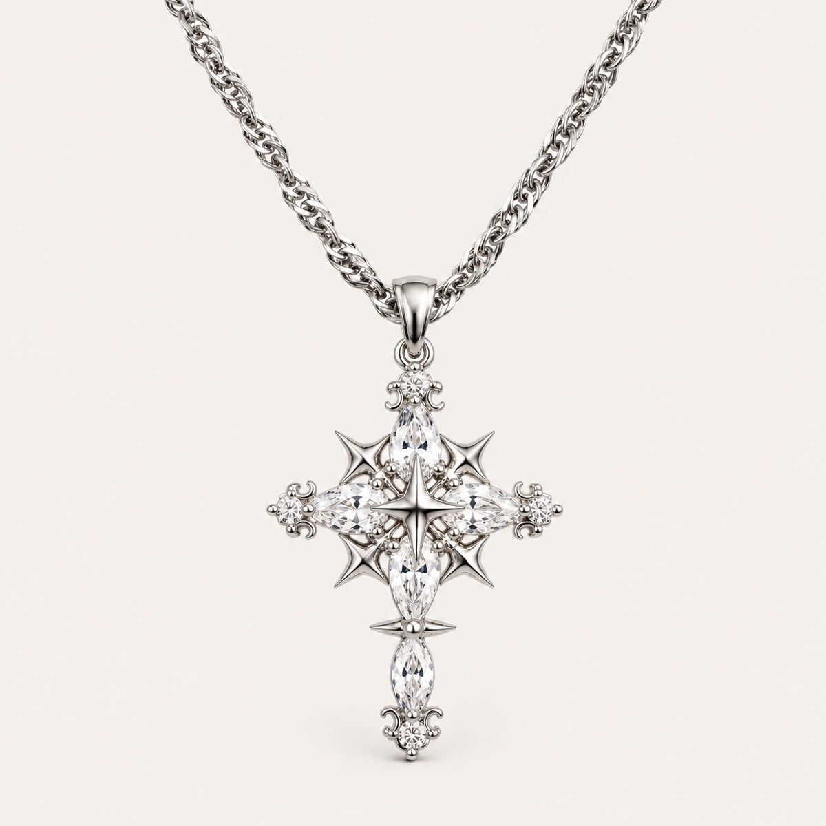 Silver Celestial Gothic Cross Necklace with Clear Zirconia Accents on an Ivory Background