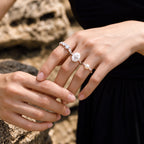 Starlight Aura Meteorite Galaxy pearl and cubic zirconia rings worn on a model's fingers, featuring an eight-pointed star design.