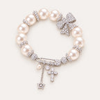 French-Inspired Pearl Bow Charm Bracelet – Crystal Cross & Star Statement Jewelry