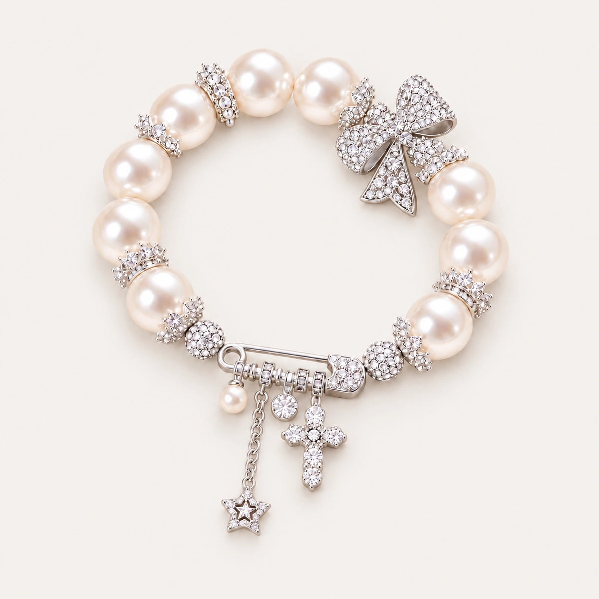 French-Inspired Pearl Bow Charm Bracelet – Crystal Cross & Star Statement Jewelry