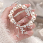 French-Inspired Pearl Bow Charm Bracelet – Crystal Cross & Star Statement Jewelry