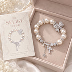 French-Inspired Pearl Bow Charm Bracelet – Crystal Cross & Star Statement Jewelry