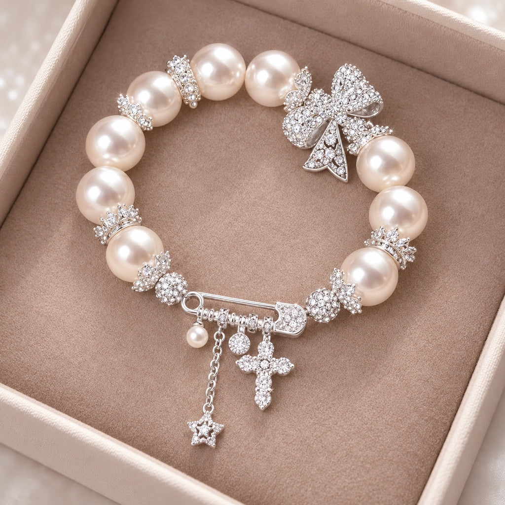 French-Inspired Pearl Bow Charm Bracelet – Crystal Cross & Star Statement Jewelry