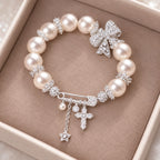 French-Inspired Pearl Bow Charm Bracelet – Crystal Cross & Star Statement Jewelry