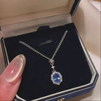 Elegant Lab-Grown Blue Sapphire Pendant Necklace with Silver-Tone Chain and Sparkling Zircon Halo