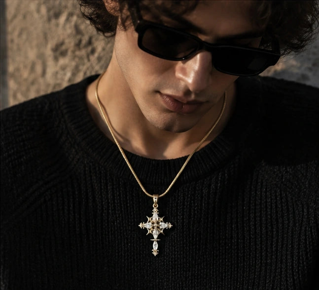 Men's Gold Gothic Cross Pendant Necklace Styled with a Black Knit Sweater and Sunglasses